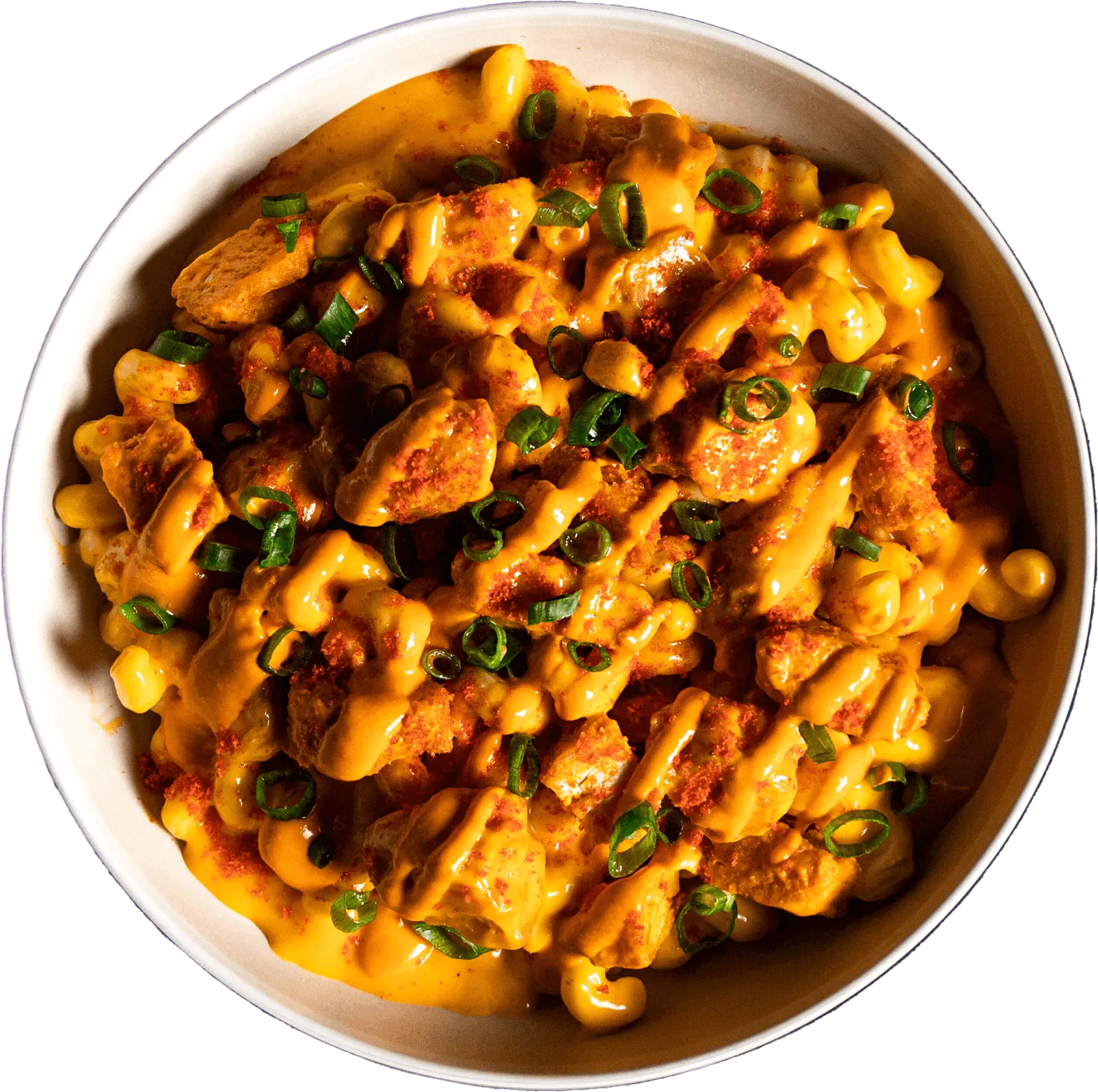 Packed Bowls by Wiz Khalifa Blazed Bowl - Creamy signature Mac & Yellow layered with fried chicken nuggs tossed in Blaze sauce. Topped with green onions and Blaze sauce drizzle, and finished with Hot Cheetos dust.